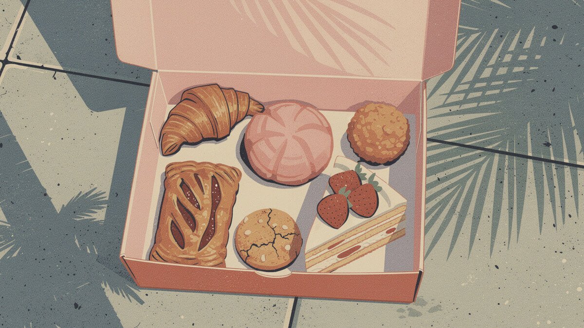 A pink pastry box with a croissant, a concha, a potato ball, a guava pastry, an almond cookie, and strawberry cake on a Los Angeles sidewalk table